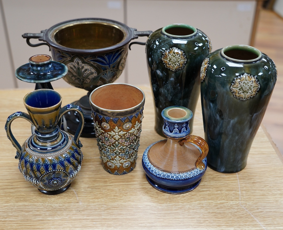 Seven Royal Doulton mixed vases etc, including two candlesticks, a pair of vases, a beaker, etc, tallest 21cm. Condition - the two handled pedestal jar has lost its lid, the other items are good